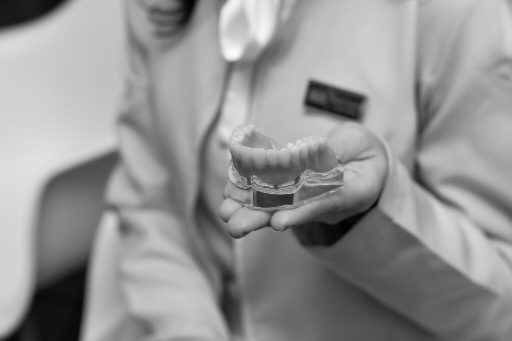 Same-Day dental implants or teeth in a day model being shown to a patient